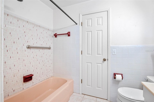 full bath with tile patterned floors, toilet, tile walls, wainscoting, and  shower combination