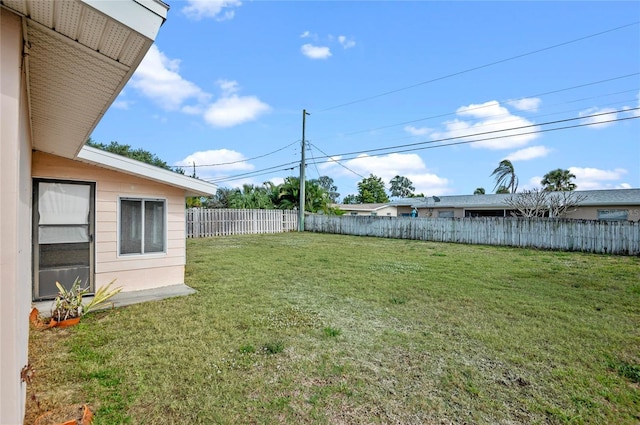 view of yard with a fenced backyard