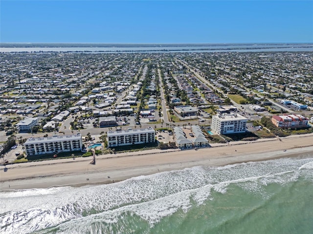 bird's eye view with a water view and a view of the beach