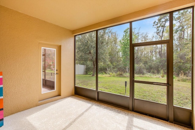 unfurnished sunroom with plenty of natural light