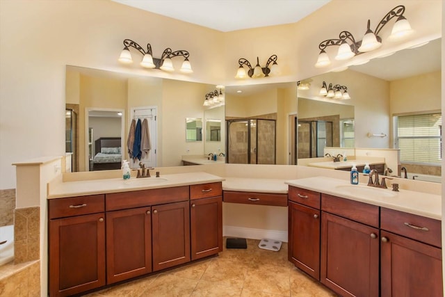 ensuite bathroom with two vanities, a sink, and a shower stall