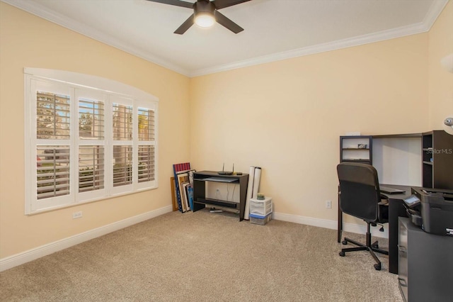 carpeted office space featuring ceiling fan, ornamental molding, and baseboards