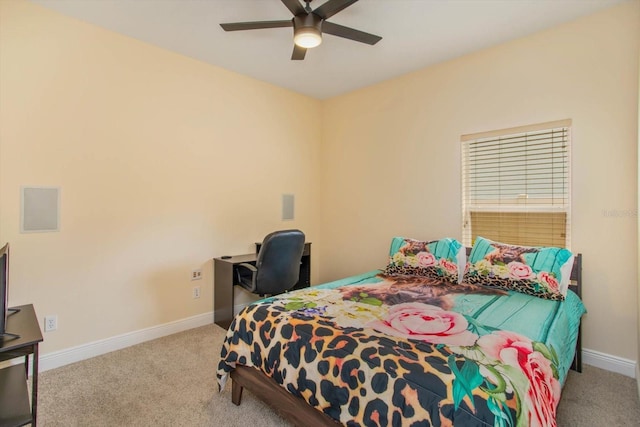 carpeted bedroom featuring a ceiling fan and baseboards