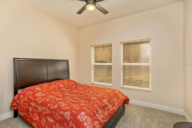 bedroom with carpet, ceiling fan, and baseboards