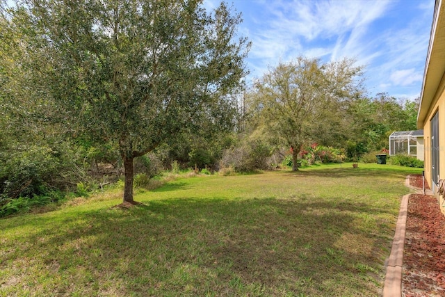 view of yard with a lanai