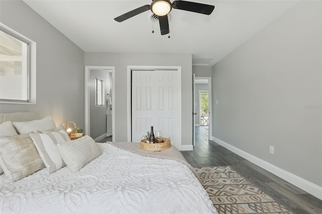 bedroom featuring a closet, baseboards, dark wood-style floors, and a ceiling fan