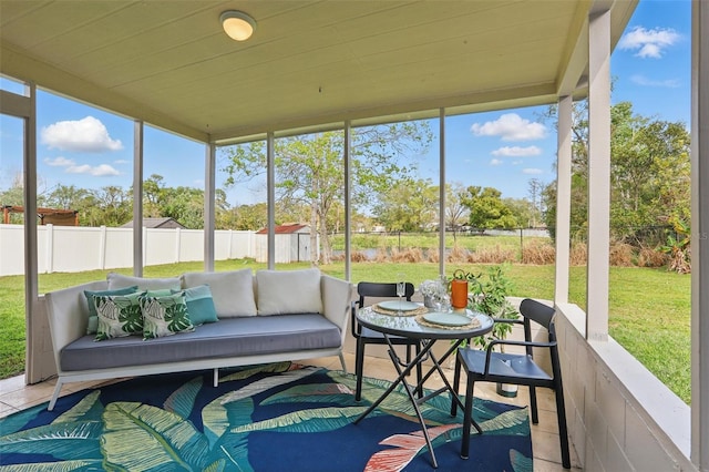 sunroom / solarium featuring wood ceiling