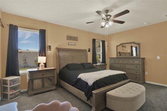 carpeted bedroom featuring a textured ceiling, ceiling fan, and baseboards