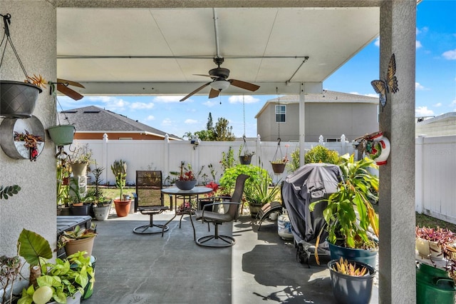 view of patio / terrace featuring a fenced backyard, a ceiling fan, and a grill