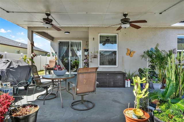 view of patio / terrace featuring outdoor dining area and fence