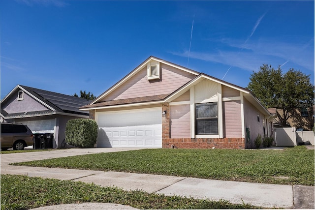 ranch-style house with an attached garage, brick siding, fence, concrete driveway, and a front lawn