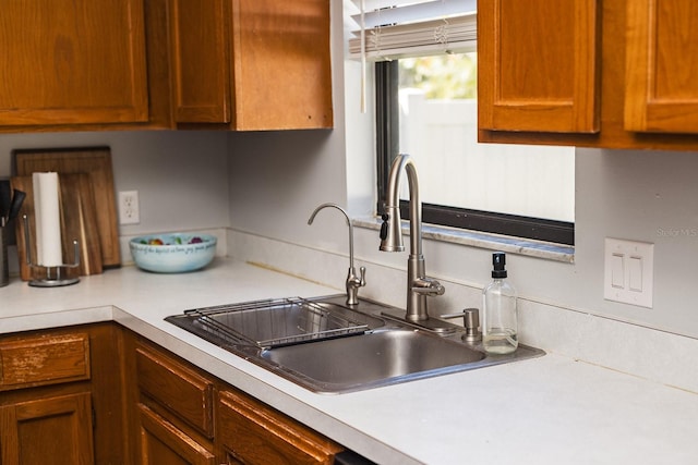 kitchen with light countertops and a sink