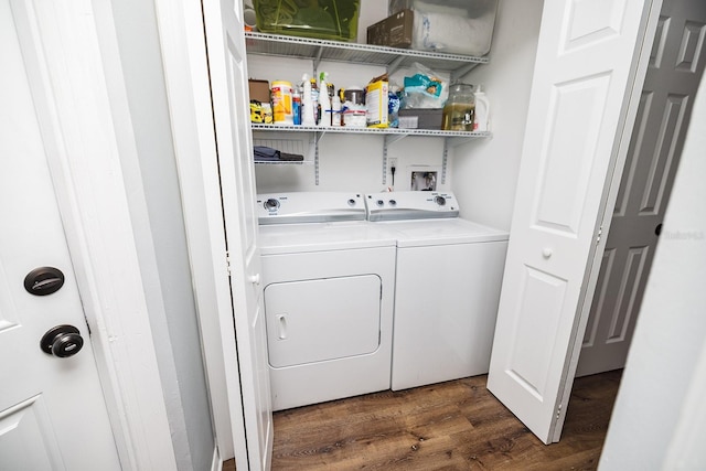 clothes washing area featuring laundry area, dark wood-style floors, and separate washer and dryer