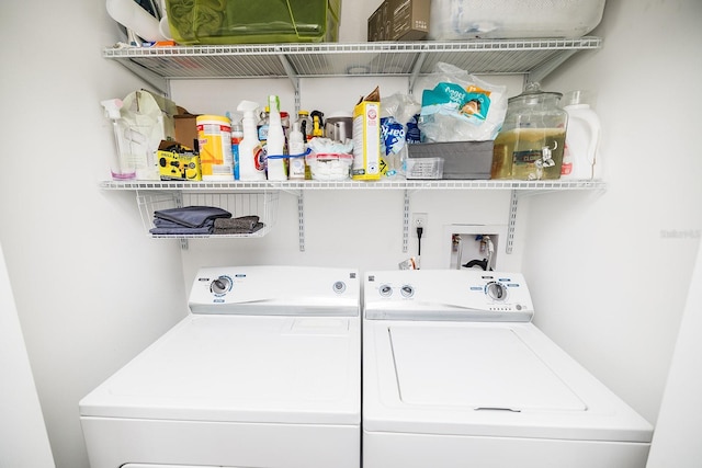 laundry room with laundry area and washing machine and clothes dryer