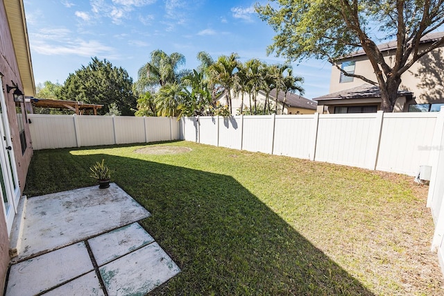 view of yard with a fenced backyard and a patio