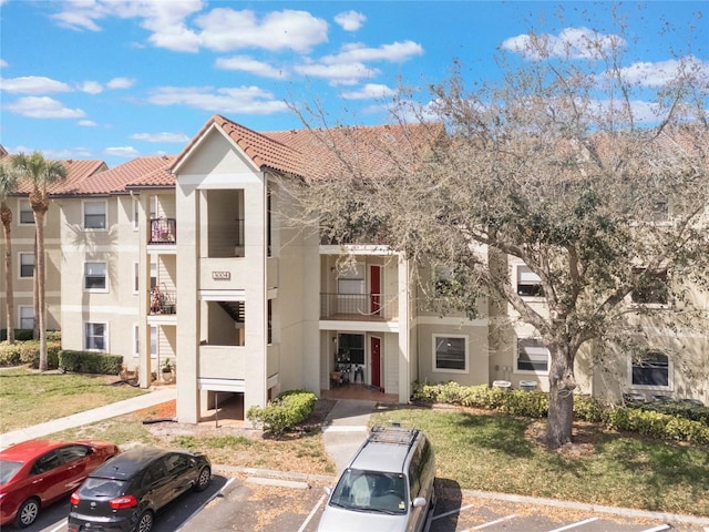 view of property with uncovered parking