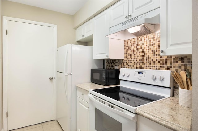 kitchen with white appliances, white cabinets, under cabinet range hood, and decorative backsplash