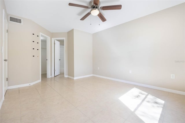 empty room featuring visible vents, ceiling fan, baseboards, and light tile patterned flooring