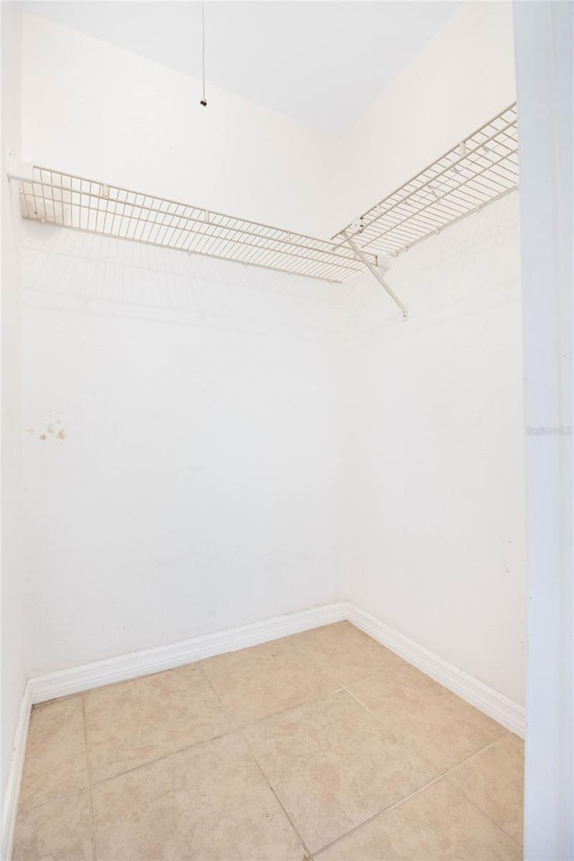 walk in closet featuring light tile patterned floors