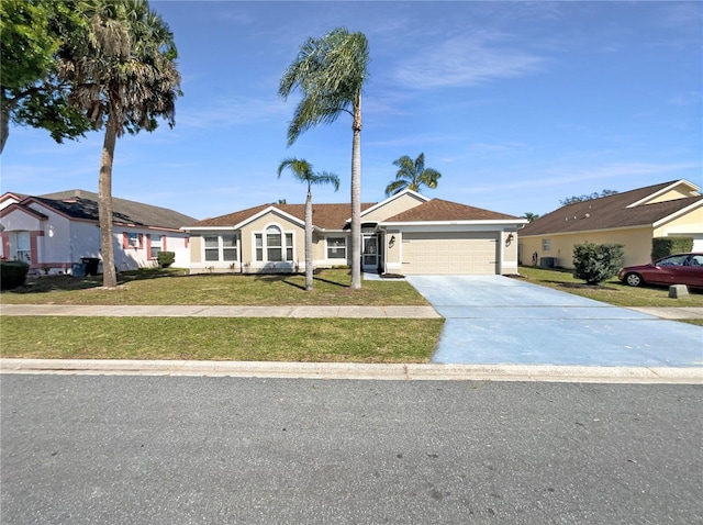 single story home featuring a garage, a front yard, concrete driveway, and stucco siding