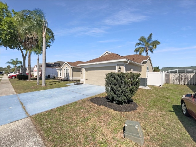 single story home with driveway, a front lawn, fence, and stucco siding