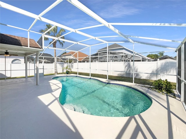 view of pool with a fenced in pool, a ceiling fan, a patio area, a lanai, and a fenced backyard