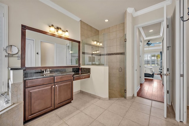 ensuite bathroom with tile patterned floors, a stall shower, ensuite bathroom, and crown molding