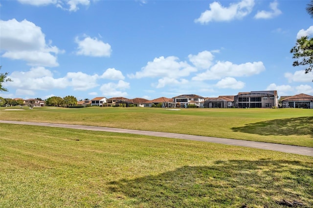 view of home's community with a lawn and a residential view