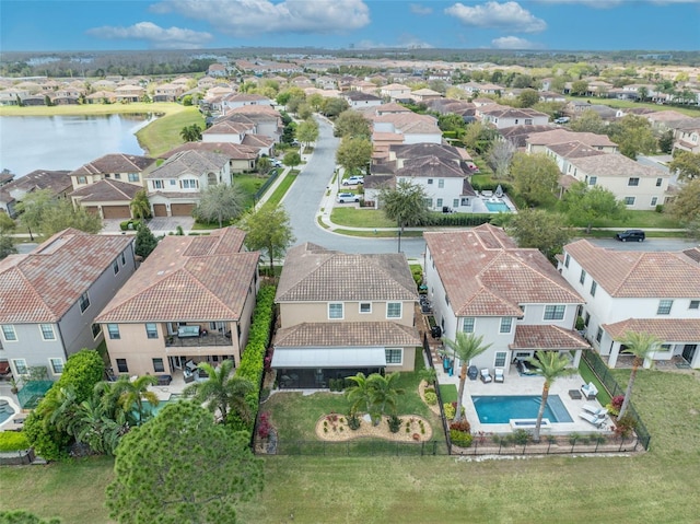 birds eye view of property with a residential view and a water view