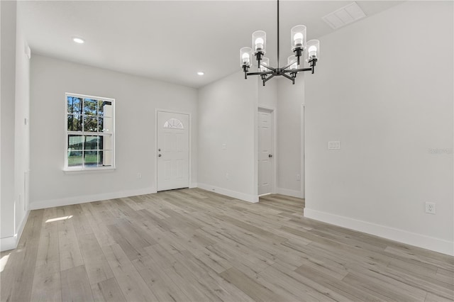 unfurnished dining area with light wood-style flooring, visible vents, baseboards, and recessed lighting