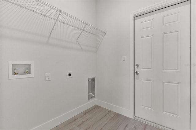 laundry area with washer hookup, light wood-style flooring, electric dryer hookup, laundry area, and baseboards