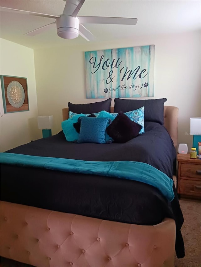 carpeted bedroom with a ceiling fan