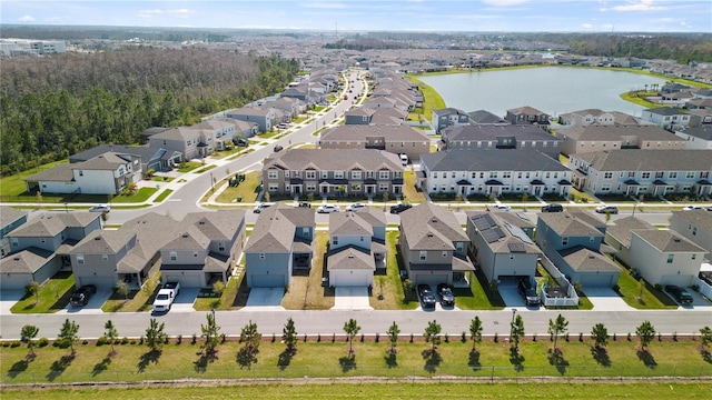 bird's eye view with a residential view and a water view