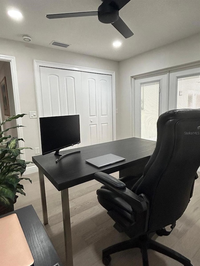 home office featuring a ceiling fan, recessed lighting, visible vents, and wood finished floors