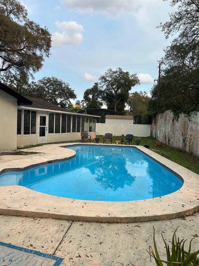 view of pool featuring a fenced in pool, a fenced backyard, and a patio