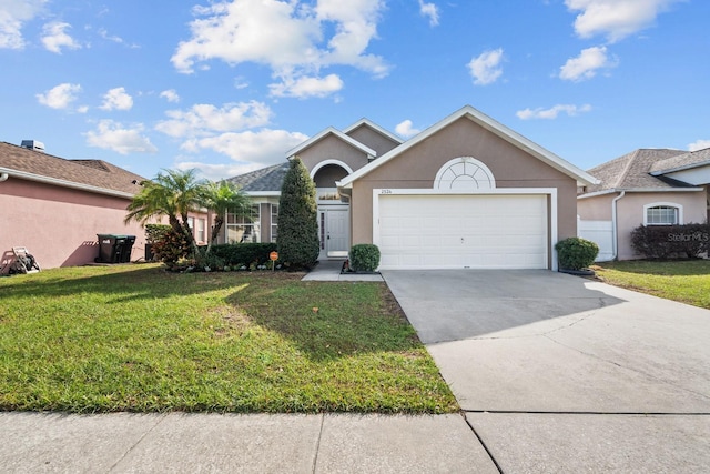 ranch-style home with stucco siding, an attached garage, driveway, and a front yard