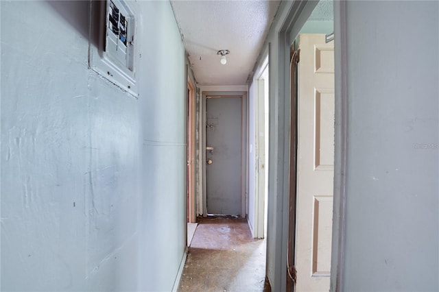 corridor featuring unfinished concrete floors