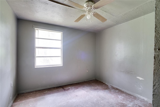 unfurnished room featuring a textured ceiling and a ceiling fan