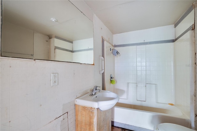 bathroom with shower / bath combination, toilet, and vanity