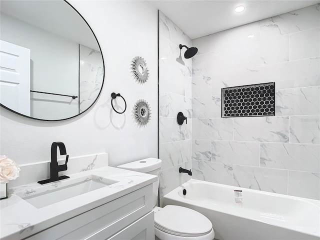 bathroom with shower / bathing tub combination, vanity, and toilet