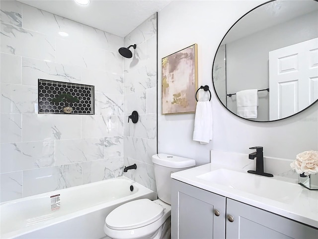 bathroom featuring toilet, shower / bath combination, and vanity