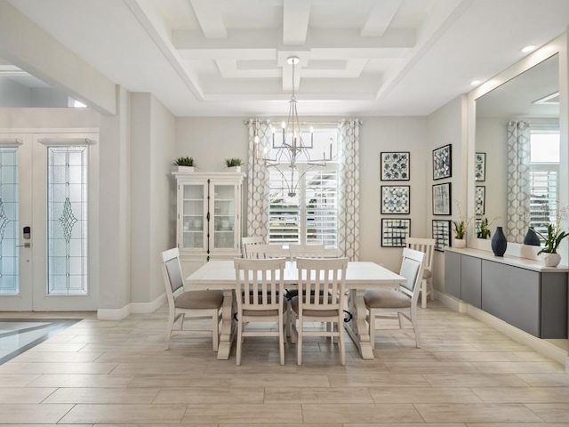 dining area featuring french doors, beam ceiling, light wood-style floors, a chandelier, and baseboards