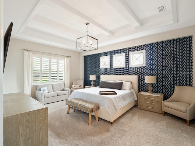 bedroom with beam ceiling, a notable chandelier, light colored carpet, visible vents, and an accent wall