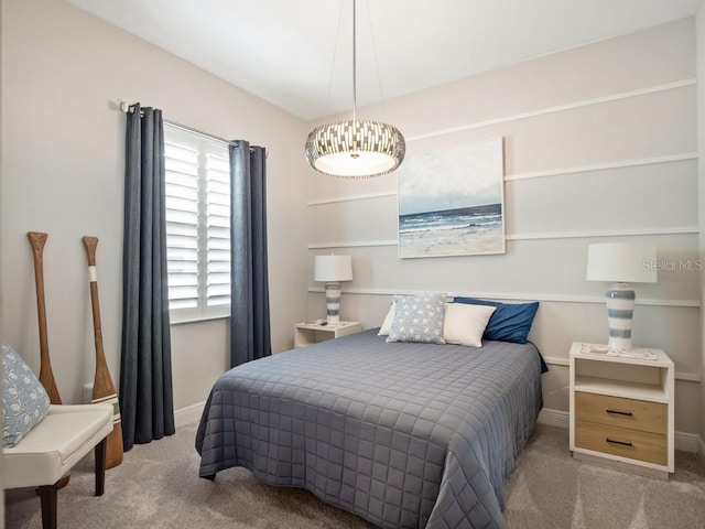 carpeted bedroom with baseboards