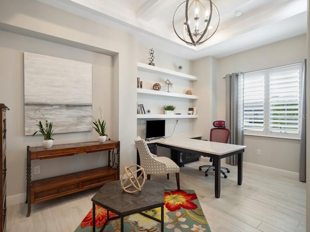 office space with baseboards, light wood finished floors, and a notable chandelier