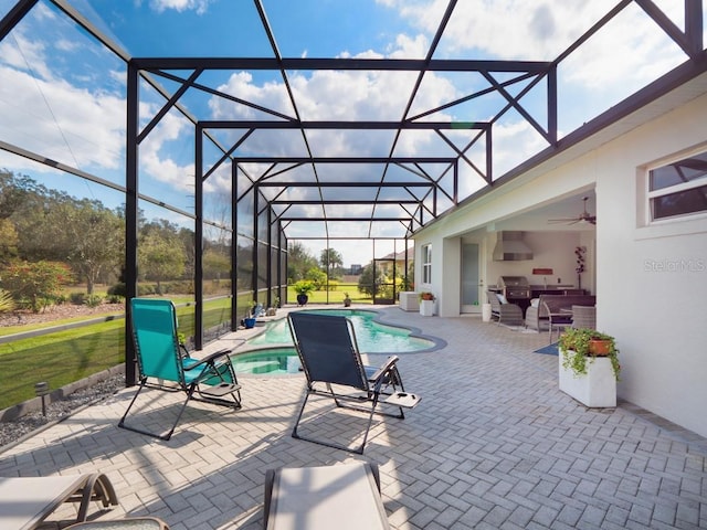 view of patio / terrace with a lanai and an outdoor pool