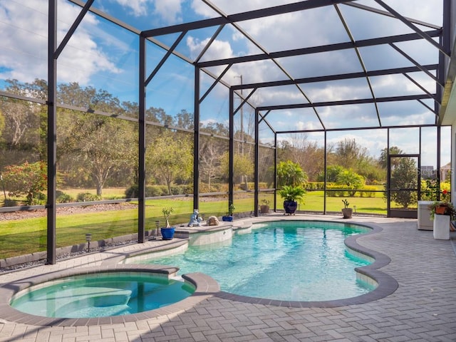 view of pool featuring glass enclosure, a lawn, a patio area, and a pool with connected hot tub