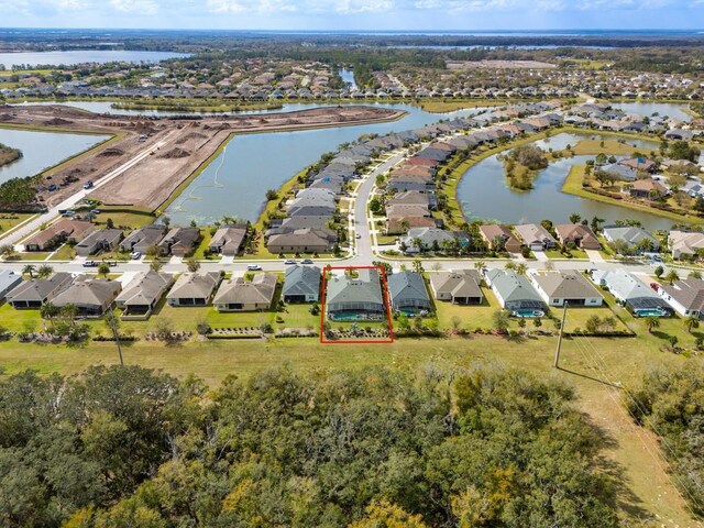 birds eye view of property featuring a residential view and a water view