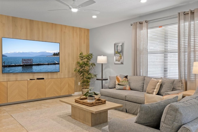 living room with a ceiling fan, recessed lighting, light tile patterned flooring, and plenty of natural light