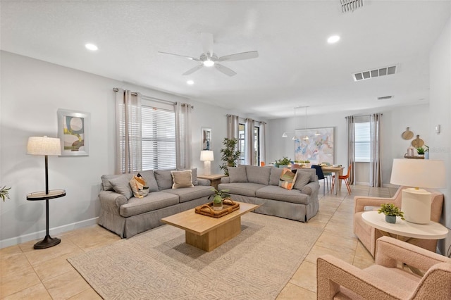 living area with plenty of natural light, visible vents, and recessed lighting